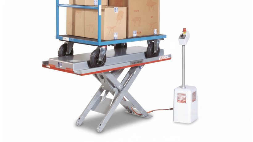 Flexlift flat form lift table FMA in E shape with a transport trolley on the platform